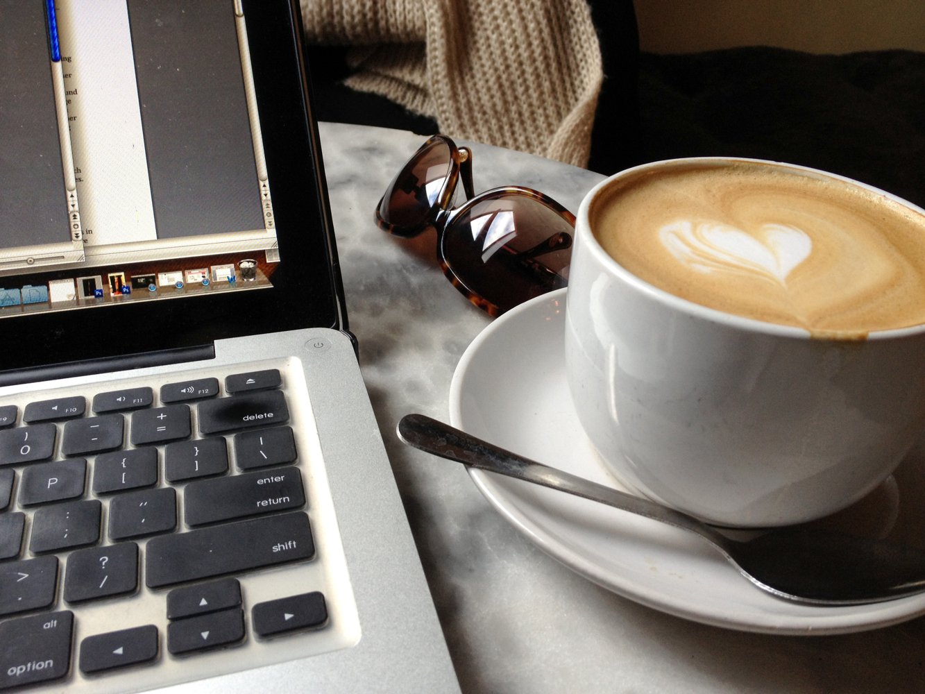 A welcoming workspace with a laptop and coffee